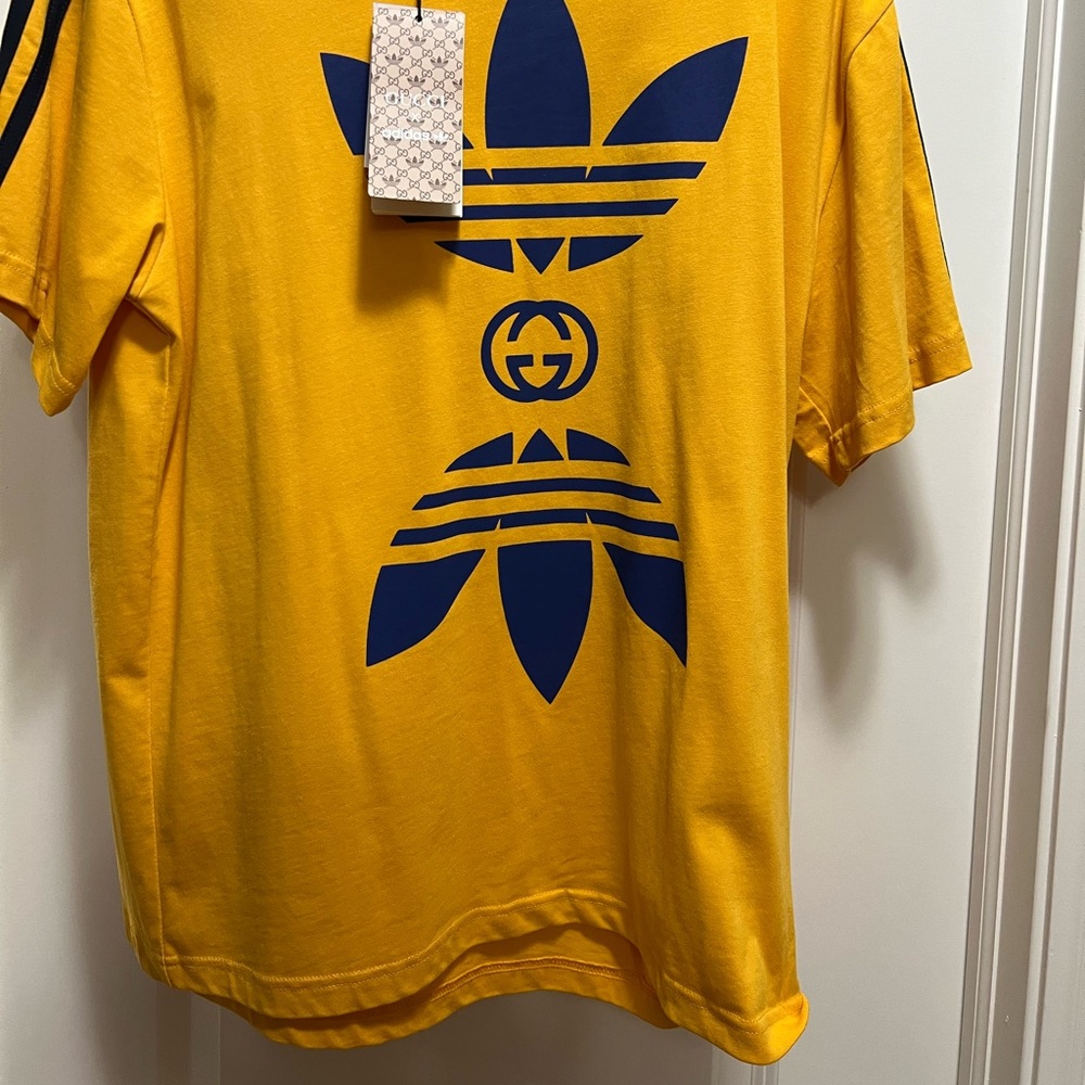 Brand new yellow Gucci, Adidas T-shirt, size medium fits like a large